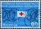 Switzerland - Circa 1975 : a postage stamp printed in the swiss showing a barbed wire fence with the Red Cross flag