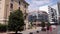 Switzerland, cityscape of Lugano. A pair of young people are walking around the city, Girl in red, Man in black.