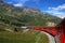 Switzerland: July 2012, Famous red alpine train Bernina Express from St.Moritz to Tirano near Bernina Pass in Switzerland