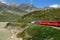 Switzerland: July 2012, Famous red alpine train Bernina Express from St.Moritz to Tirano near Bernina Pass in Switzerland