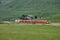 Switzerland: July 2012, Red Alpine Train Bernina Express from St.Moritz to Tirano near Bernina Pass in Switzerland