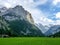 Switzerland, Lauterbrunnen, SCENIC VIEW OF GREEN LANDSCAPE AND M