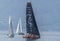 Switzerland:  An orange and black sailing boat