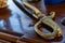 Sword weapon cold sharp handle ribbed weathered old close-up on wooden background