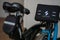 Swytch kit electric Brompton bike. A Black and blue Brompton folding bicycle