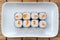 Syake roll with salmon. Hosomaki thin rolls, simple rolls, small rolls, with cucumber. top view on a white plate