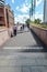 SYDNEY, AUSTRALIA - October 9th. 2017: Pedestrians crossing the bridge at Darling Harbour.