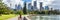 Sydney city Australia travel panorama banner. Landscape horizontal header of australian skyscrapers with person walking