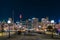 Sydney City night skyline viewed from Pyrmont Bridge through Darling Harbour