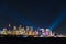 Sydney cityscape at night with colorful lights illuminating skyline