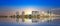 Sydney Harbour Australia at Sunset with the reflection of the Buildings and high rise offices of the City in the water