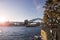 Sydney Harbour Bridge with golden sun flare on calm seas