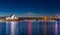 Sydney Harbour Bridge at night and CBD buildings on the foreshore in NSW Australia