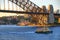 A Sydney Harbour Ferry Cruising Past The Harbour Bridge In Darling Harbour In Sydney, Australia.