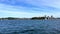 Sydney Harbour foreshore on a party cloudy sky. viewed from ferry on way to Manly, NSW Australia