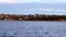 Sydney Harbour foreshore on a party cloudy sky. viewed from ferry on way to Manly, NSW Australia