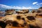 Sydney Harbour with nice rocks in the foreground and the beautiful harbour foreshore as a backdrop NSW Australia