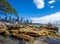 Sydney Harbour with nice rocks in the foreground the soft waves crashing on the shore NSW Australia