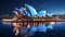 Sydney Opera House is beautifully lit at night. Australia\\\'s most popular building. Australian multi-venue performing arts .