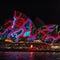 Sydney Opera House lit up at night with patterns at the Vivid Light festival - projections onto the sales of the building