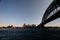 Sydney urban coastline panorama in dusk with iconic Harbor Bridge , Opera House, and Circular Quay skyline on waterfront.