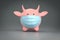 Symbol of 2021 Pink bull or cow figure as Piggy Bank in face medical surgical mask save money investment