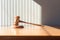 Symbol of Authority: Gavel on Wooden Table