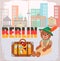 Symbol of Berlin Bear with a Suitcase with Stickers all over the World against the background of the Cityscape Berlin