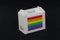 Symbol color of LGBTQ+ flag and barcode on white box with black background, paper packaging for put products