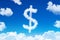 Symbol of a dollar in the form of clouds of steam against a blue sky with clouds.