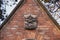 Symbol of the Dominican Order. Picture Bas-relief of a dog that holds a burning torch in the teeth. Facade of  the Dominican