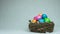 The symbol of Easter dyed and painted colored eggs are in the nest, feathers fall down, concept of Christian holiday