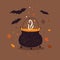 Symbol of halloween. Witches cauldron with smoking potion and bats.