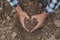 Symbol heart earth day. Handful of dirt hands heart shape. Farm organic earth. Farmer hands soil ground earth dirt garden soil