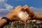 Symbol of heart made up of womens fingers through it is seen Cappadocia