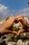 Symbol of heart made up of womens fingers through it is seen Cappadocia