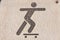A symbol, people are playing skateboarding.