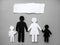 Symbol of a person and family cut out of black and white paper. Interracial family. Space for text. mixed race marriage