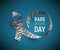 Symbol of rare disease awareness day, ribbon with zebra-print.