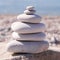 Symbol Scales is made of stones of various shapes. Balance of stones. Balancing stones on the shore. Tourism, travel.