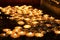 Symbol of sorrow and religious tradition burning candles for repose in a Christian church, a Buddhist monastery