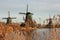 Symbol of a tradition now lost, now a mere tourist attraction. colorful windmills built of wood still overlook the water of the