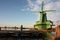 Symbol of a tradition now lost, now a mere tourist attraction. colorful windmills built of wood still overlook the water of the