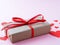 Symbol of Valentine`s day - gift box in kraft brown paper with a