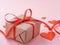 Symbol of Valentine`s day - gift box in kraft brown paper with a