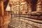 Symbolic sculptures and reliefs in Indian temple wall. Ancient architecture example with Hindu and Jain motifs, India.