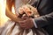 Symbolic touch bride and groom grasp hands, sealing their lifelong commitment