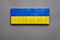 Symbolic Ukraine symbol national banner background UA sign. Isolated block toy wood cube made flag of Ukraine design