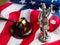 Symbols of freedom and democracy of the United States of America - the national flag, the gavel of the judge and the sculpture of