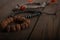 symbols of religions, Islamic rosary, Christian black rosary and a Buddhist bracelet lie together on a wooden table.